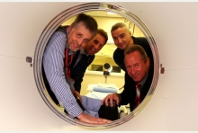 Former Nottingham Forest legend John McGovern (bottom right) takes a look inside the PET CT scanner with (from left) Dr Andrew McMillan, InHealth chief executive Richard Bradford and consultant radiologist Dr Simon Hughes